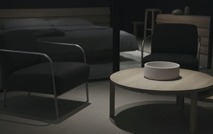 Dark themed furniture in a well-lit room